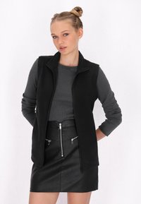 Пуховой жилет