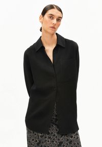 Длинная блузка