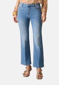 Клешеные джинсы Клешеные джинсы