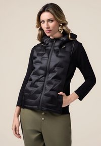 Стеганый жилет Стеганый жилет