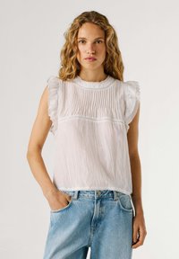 Блузка без рукавов