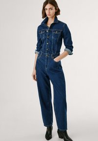 Джинсовый комбинезон Джинсовый комбинезон