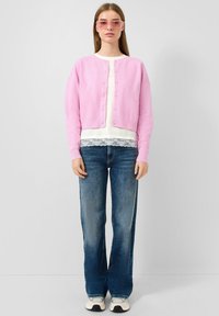 Клешеные джинсы