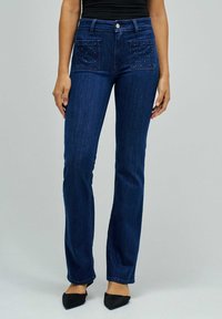 Клешеные брюки