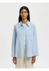 Длинная блузка