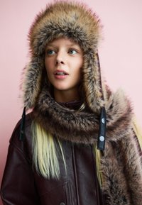 Пуховой жилет Пуховой жилет