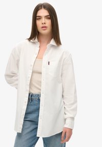 Длинная блузка