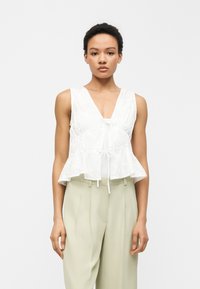 Блузка без рукавов Блузка без рукавов