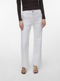 Клешеные джинсы