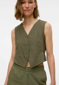 Джинсовая жилетка Джинсовая жилетка