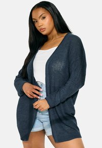 Длинный жилет