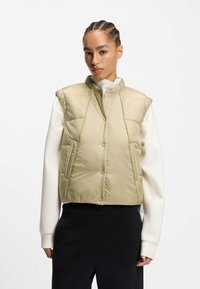 Стеганый жилет