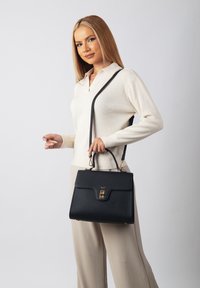 Кожаная сумка