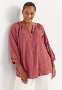 Длинная блузка