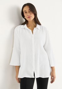 Длинная блузка